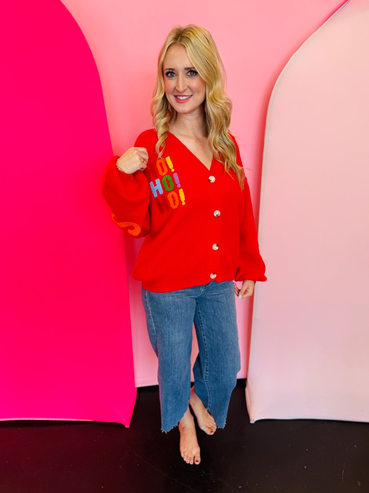 Red Christmas cardigan with HO! HO! HO! front and Merry Christmas lettering on back and sleeves.