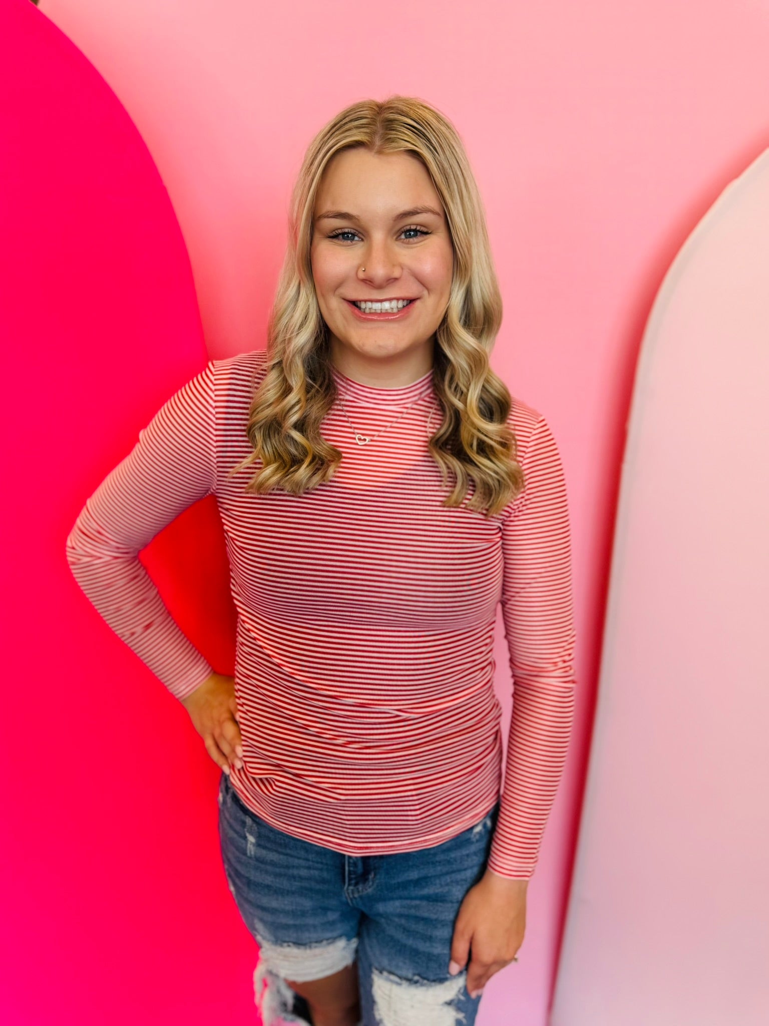 Red Striped Mesh Top with bright red and white horizontal stripes, long sleeves, crewneck, and breathable mesh fabric made of 95% polyester and 5% spandex.