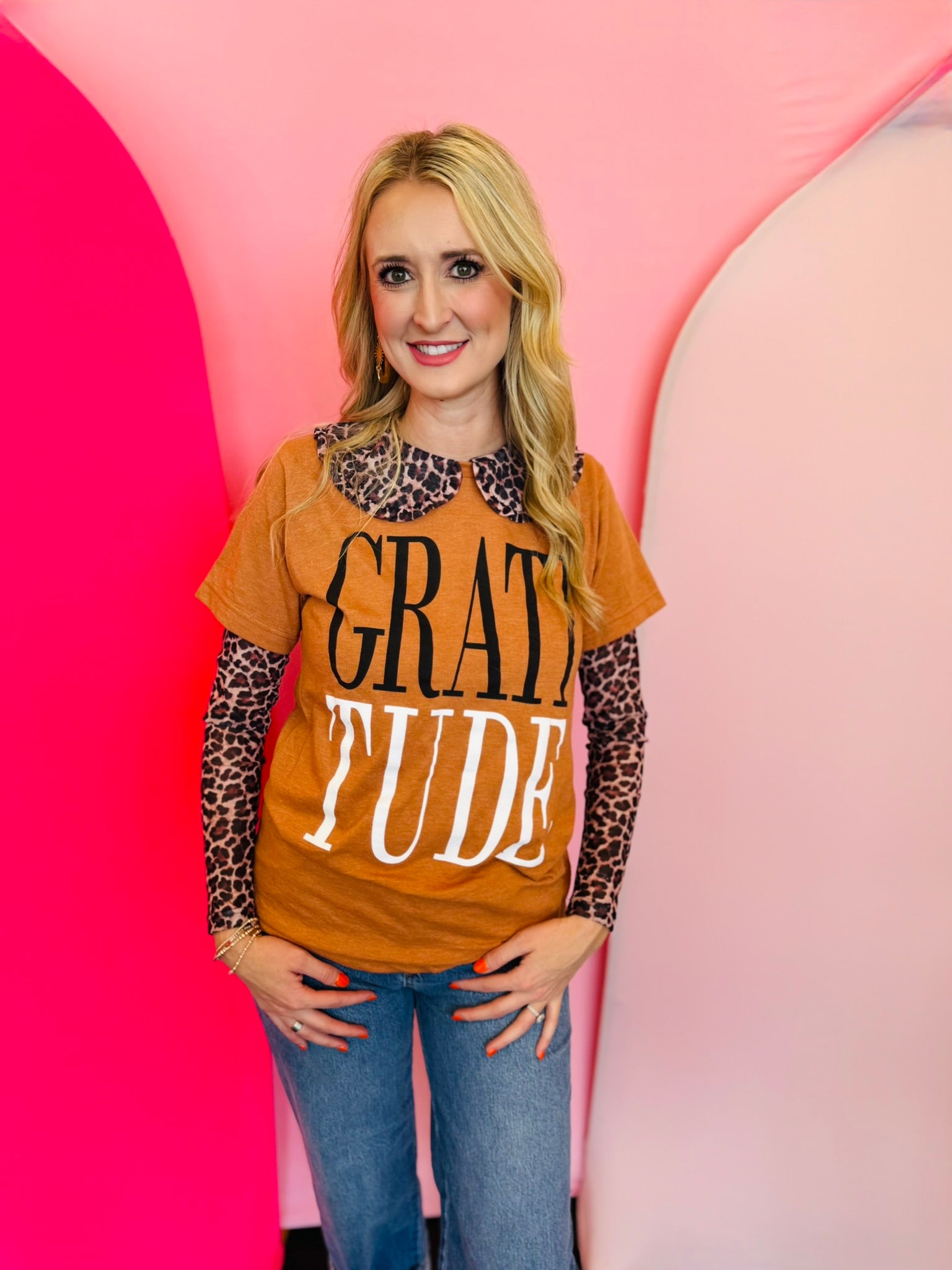 Rust colored tee with bold black and white lettering saying "gratitude"