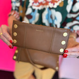 Hammitt 110 North mahogany luxury leather folding wallet with a magnetic closure, red accents and gold hardware.