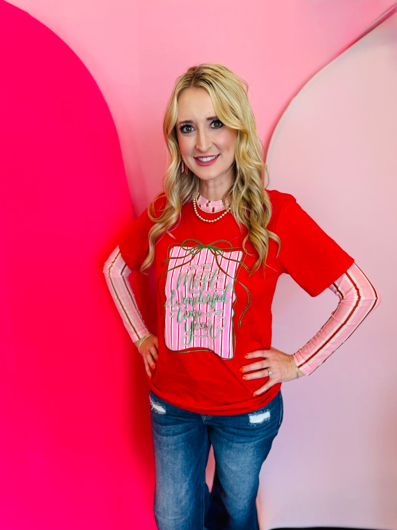 Red holiday tee with glittery “Wonderful Time of the Year” graphic, gift box, and green ribbon.