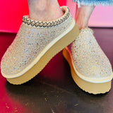 Platform slip-on shoes with rhinestones and fleece lining.