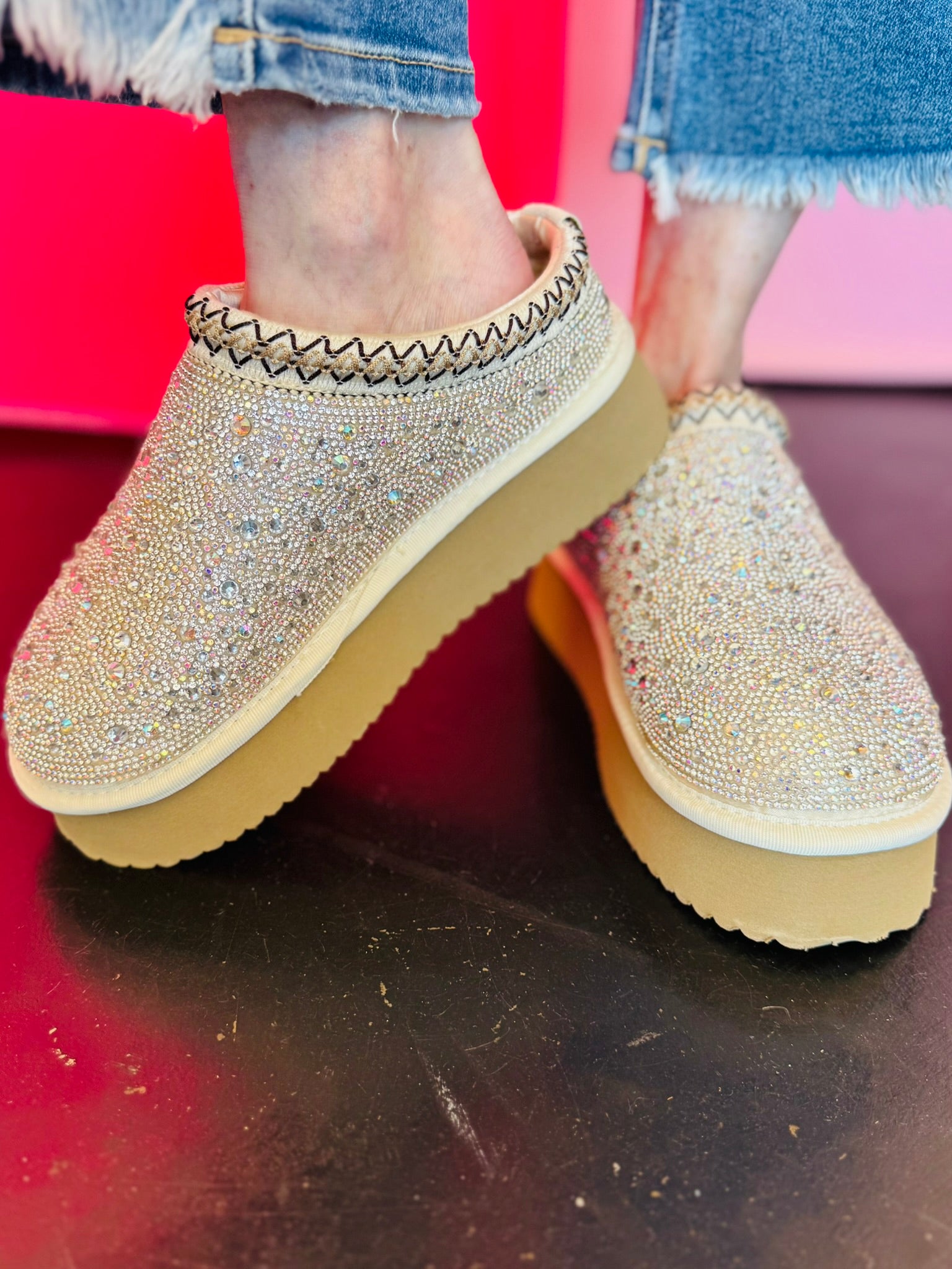 Platform slip-on shoes with rhinestones and fleece lining.