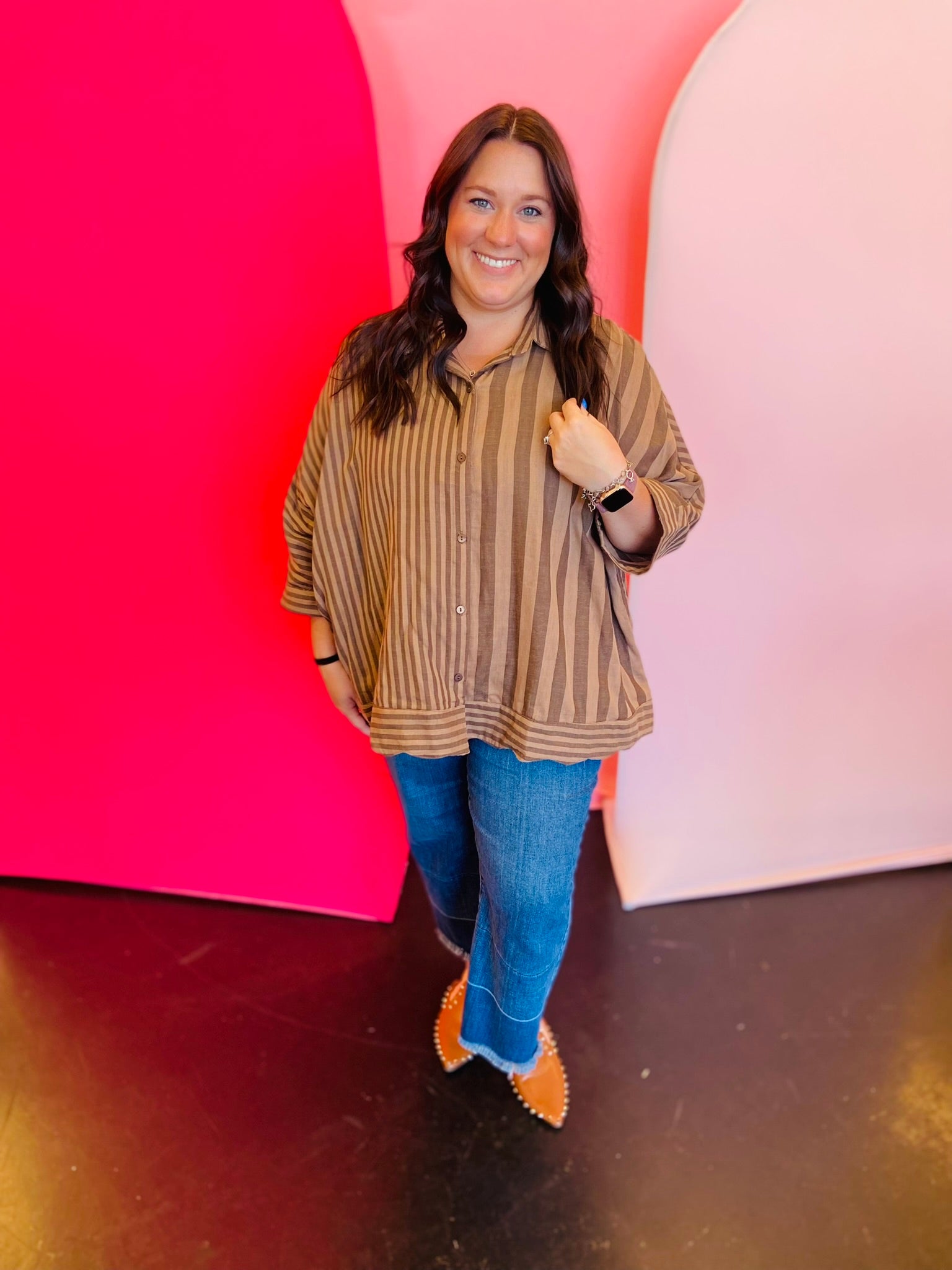 Mocha and cream striped button-down shirt with roll-tab sleeves and high-low hem.
