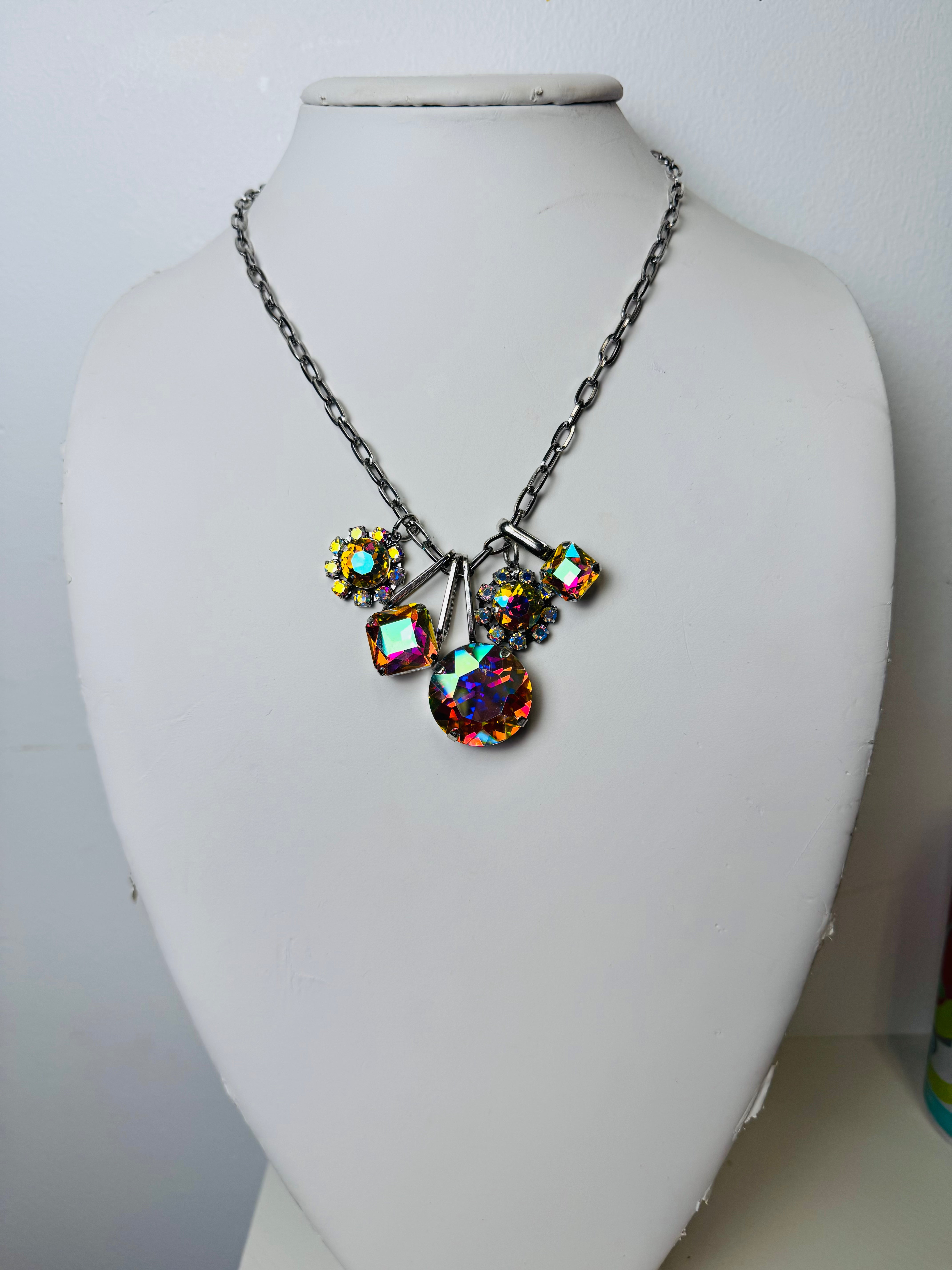 silver chain linked necklace with iridescent charms