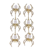 Dangling earrings with descending spiders with pearl bodies and crystal legs