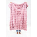 Solid pink faux fur throw blanket.