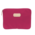 15" padded computer case in coated canvas with natural leather trim, zip closure, and padded interior.
