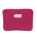 15" padded computer case in coated canvas with natural leather trim, zip closure, and padded interior.