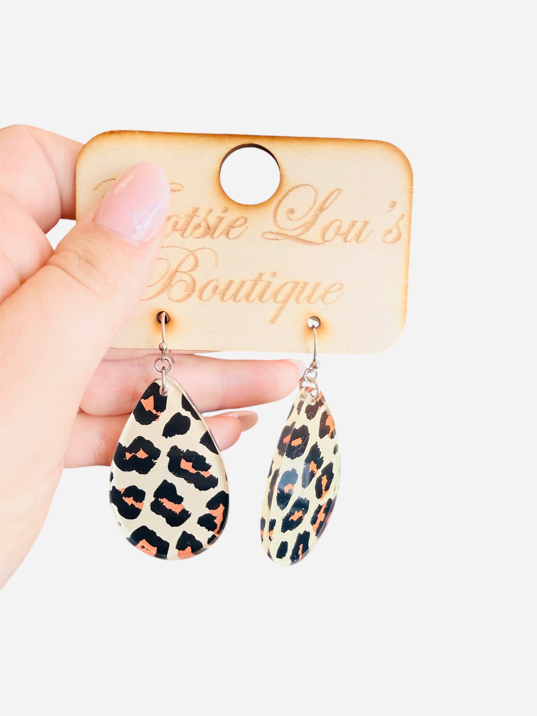 Leopard print acrylic teardrop earrings with glossy front, matte back, and lightweight design.