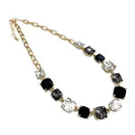 Aster Black Multi Crystal Necklace, 16–18 in gold chain with alternating black and clear faceted stones.
