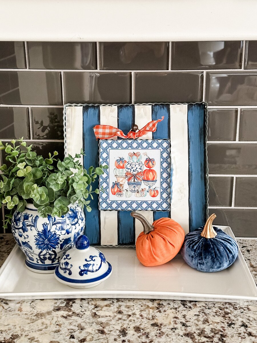 Blue pumpkin topiary with chinoiserie pots, bows, and lattice border on 12x12 fall metal board