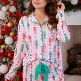Pink and aqua nutcracker pajama set with ruffle trim and festive peppermint details.