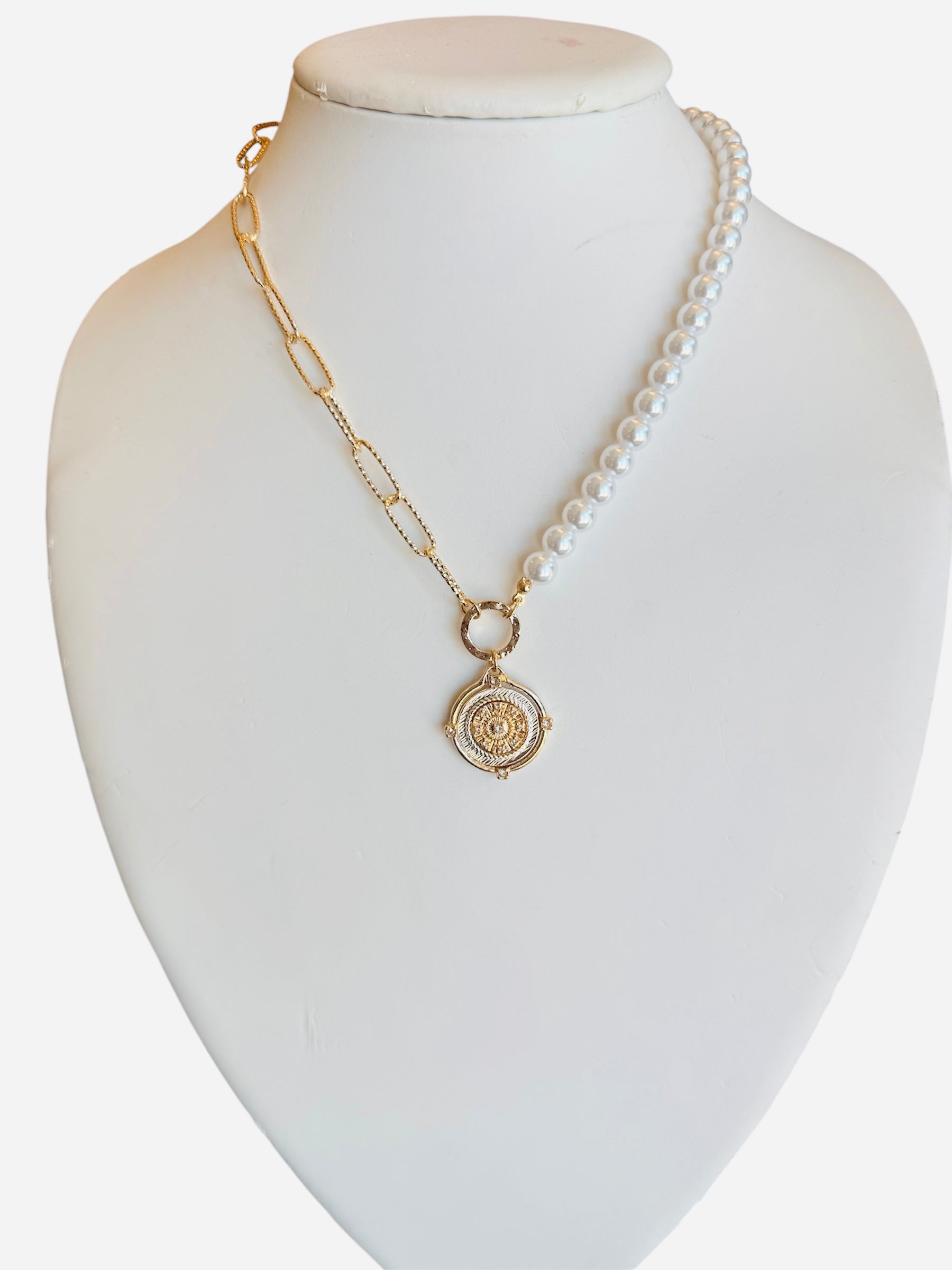 Half pearl, half gold chain necklace with gold pendant and sparkling crystal detail.
