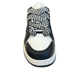 Black and white sneakers with a bold wave design, thick platform sole, and zigzag laces — modern, sporty, and edgy.