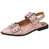 Pink pointed-toe flats with bold silver double buckle straps and a slingback backstrap, combining vibrant color with edgy charm.