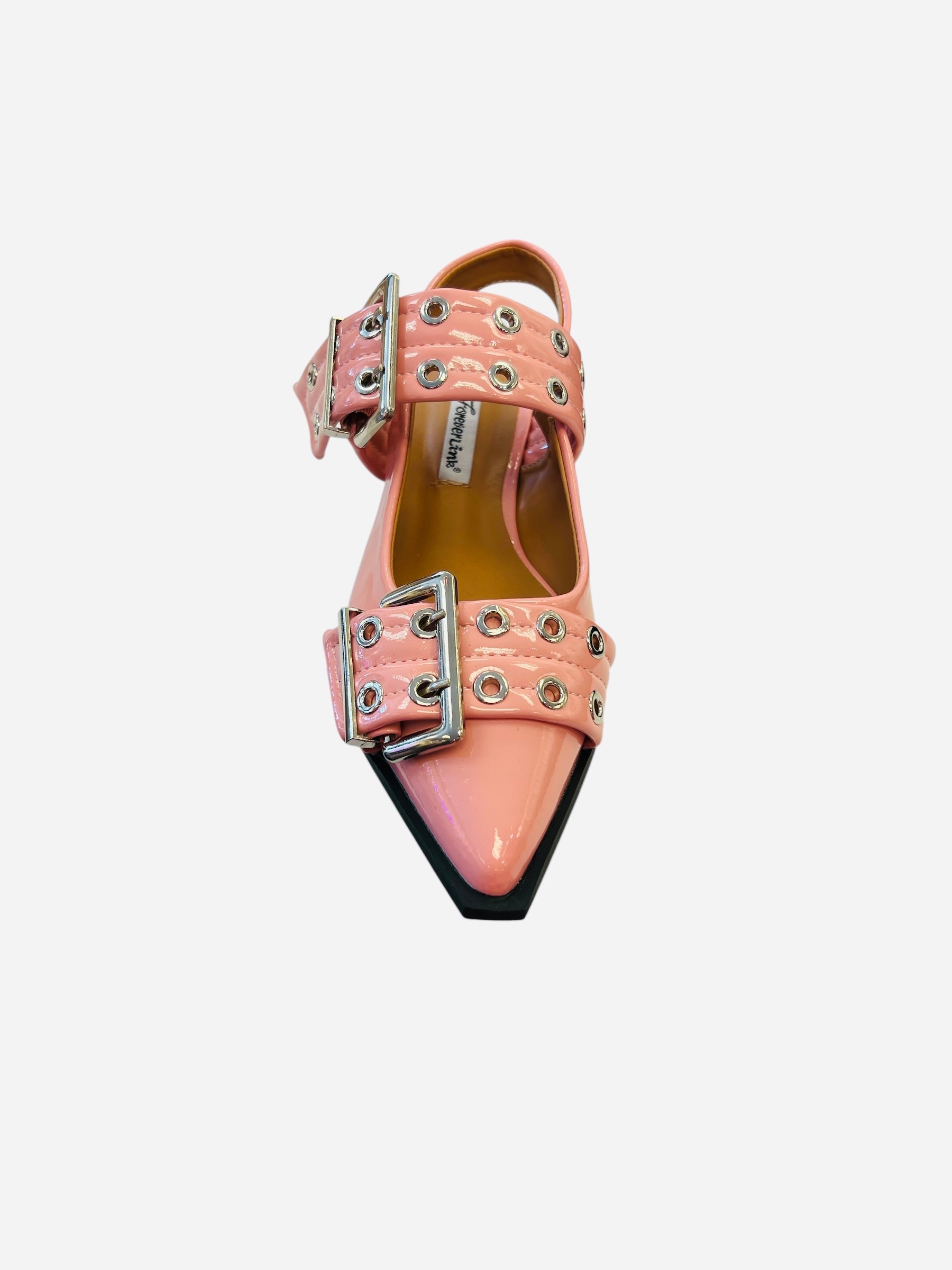 Pink pointed-toe flats with bold silver double buckle straps and a slingback backstrap, combining vibrant color with edgy charm.