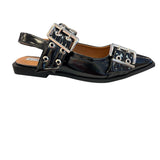Black pointed-toe flats with bold silver double buckle straps and a slingback backstrap, combining vibrant color with edgy charm.