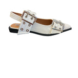 White pointed-toe flats with bold silver double buckle straps and a slingback backstrap, combining vibrant color with edgy charm.