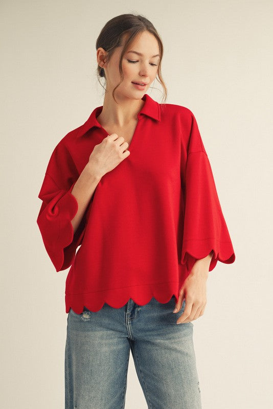 Red scalloped V-neck top with collar and 3/4 sleeves, made from soft, lightweight stretch fabric.