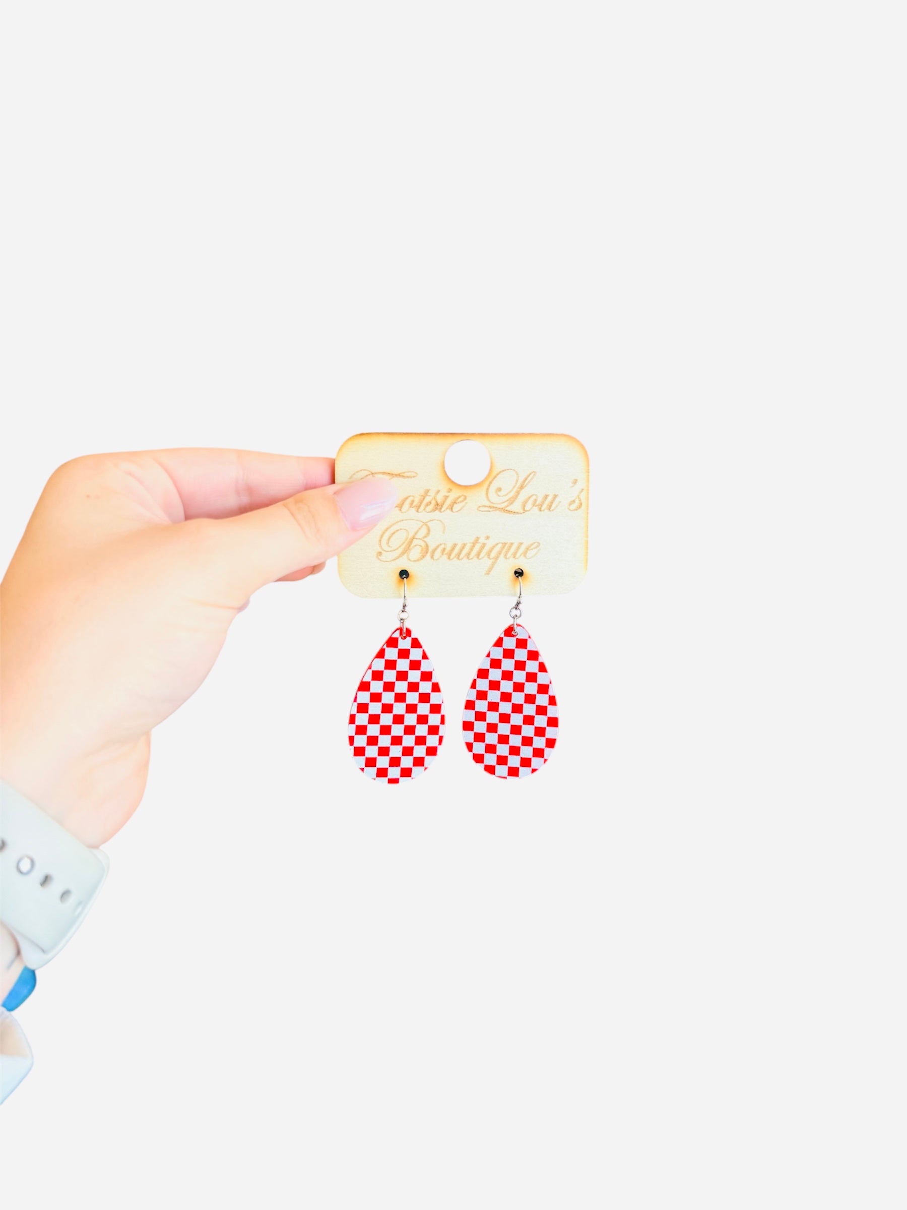 Red and white checkered teardrop acrylic earrings with glossy finish, lightweight and bold.