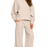 Sand beige ribbed knit pullover and pants set with round neck, elastic waist, and relaxed fit.