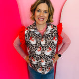 Festive leopard-print puffer vest with santa accents, perfect for layering and staying warm.