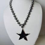 silver beaded necklace with star pendant