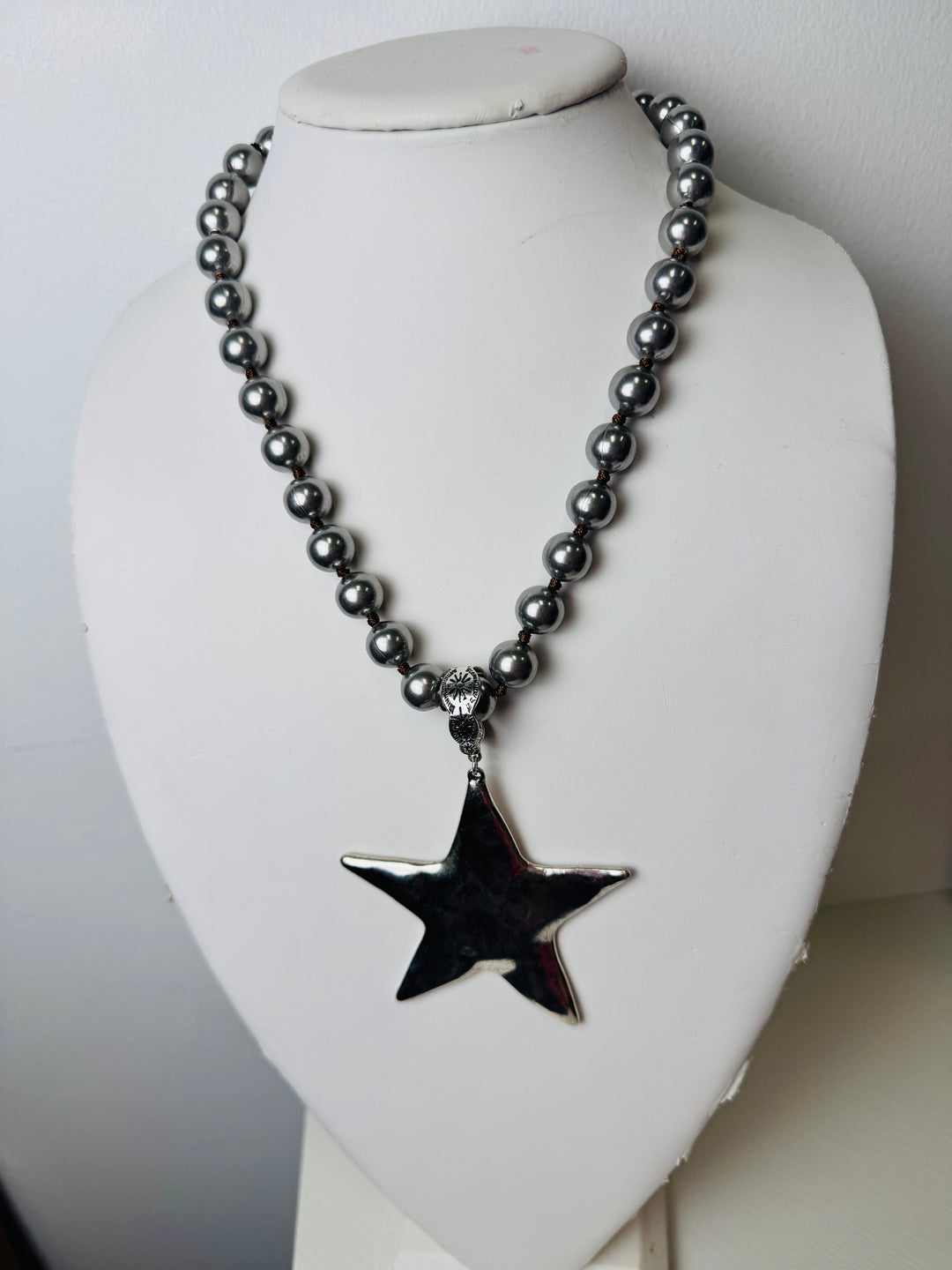 silver beaded necklace with star pendant