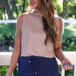 Solid navy colored skort with elastic back waistband, drawstring, built-in shorts, and side pockets in lightweight polyester-spandex fabric.