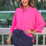 Solid navy colored skort with elastic back waistband, drawstring, built-in shorts, and side pockets in lightweight polyester-spandex fabric.