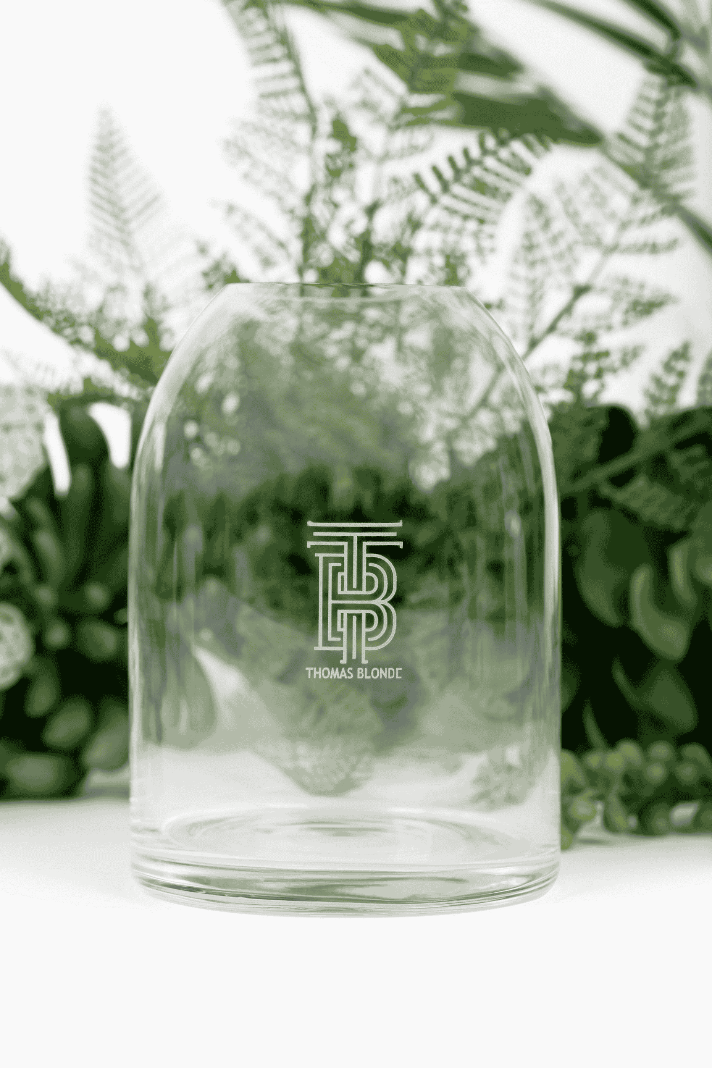 Thomas Blonde - clear glass vase with a sophisticated, intricate etched pattern on its surface.