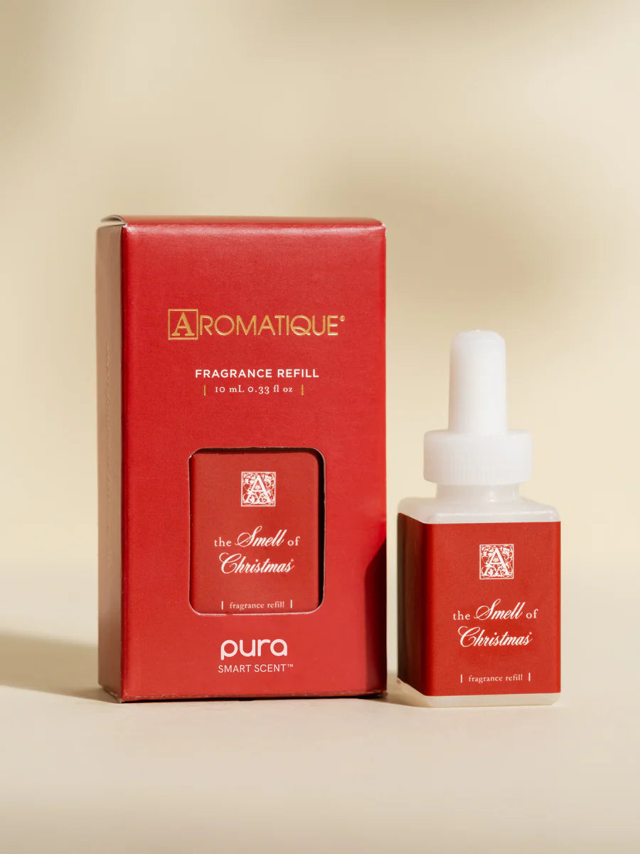 Pura The Smell of Christmas fragrance refill bottle.