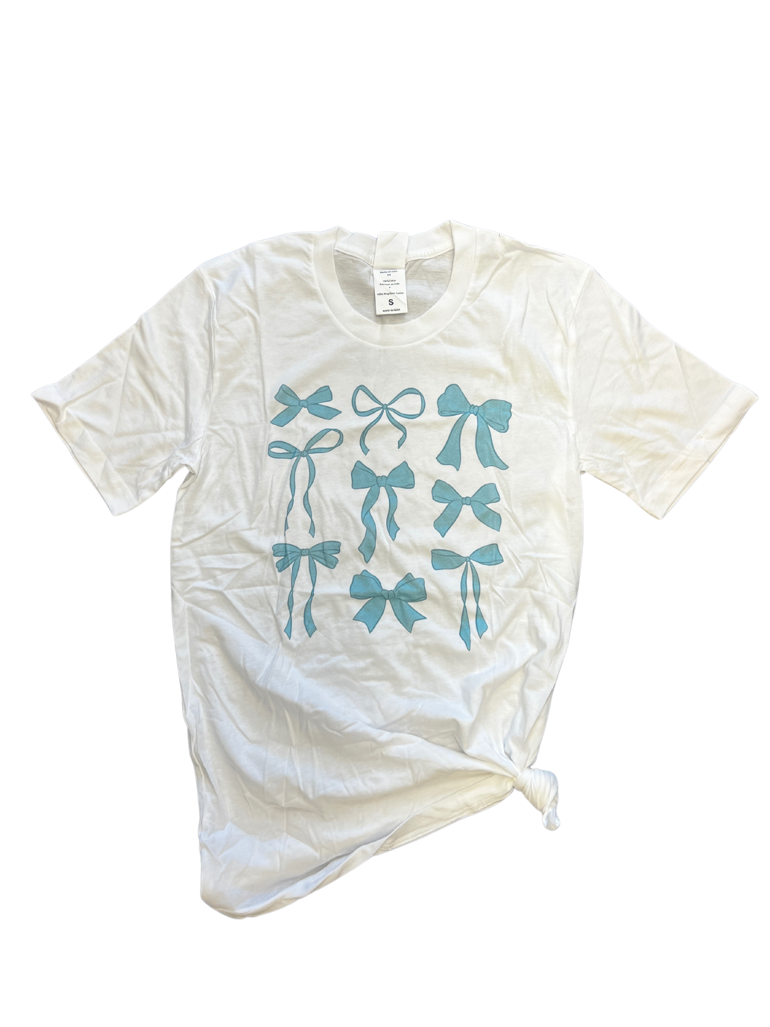 White tee with blue bow print design.