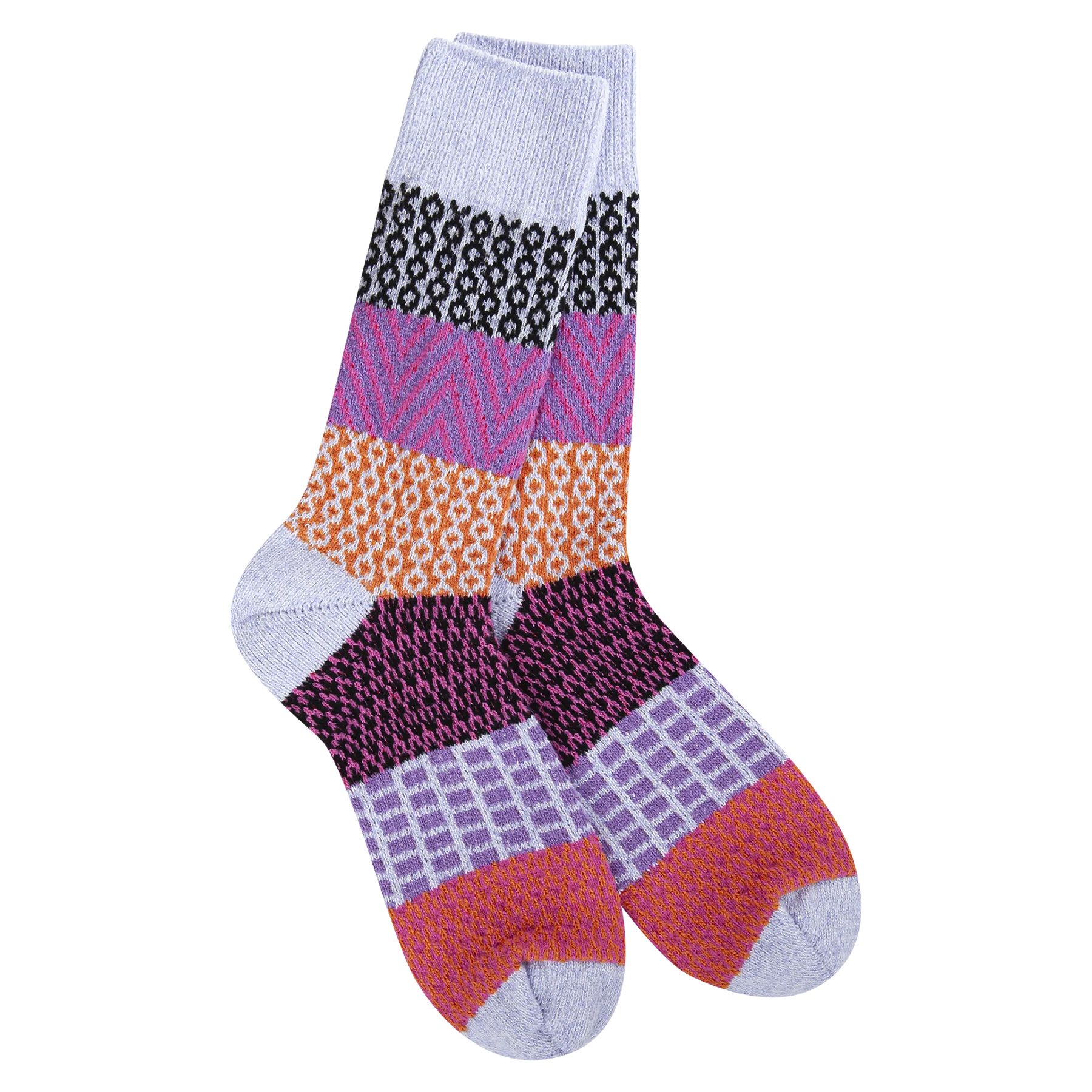 A pair of plush, soft crew socks featuring a patchwork design with various patterns like stripes and chevrons in shades of purple, red, orange, and lavender.