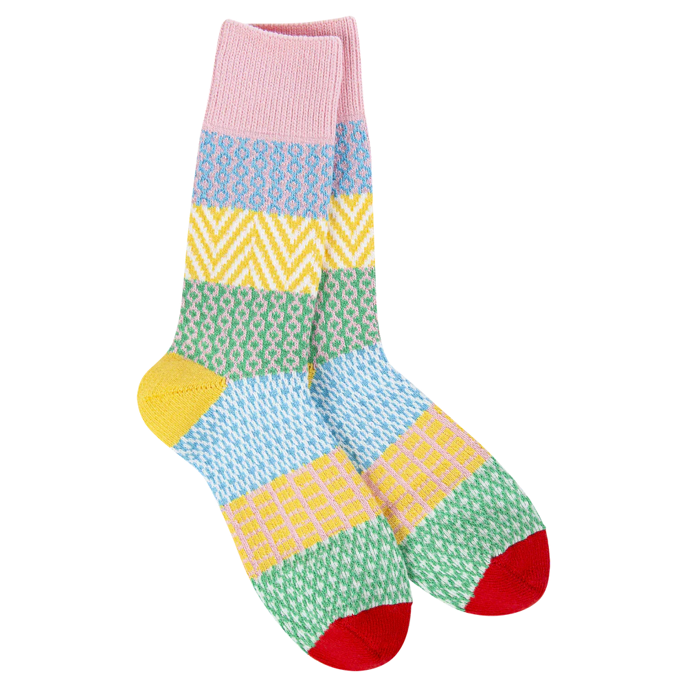 World’s Softest Socks geometric patterned crew socks in pink, blue, yellow, and green with red toes and gold heels.