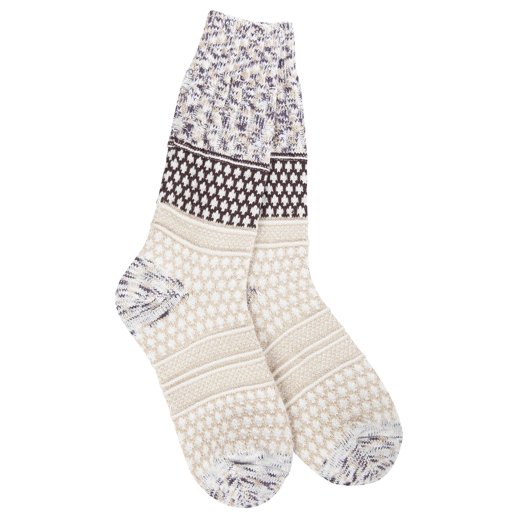 A pair of plush, soft crew socks with a patchwork design featuring various geometric patterns in shades of cream, beige, and brown.