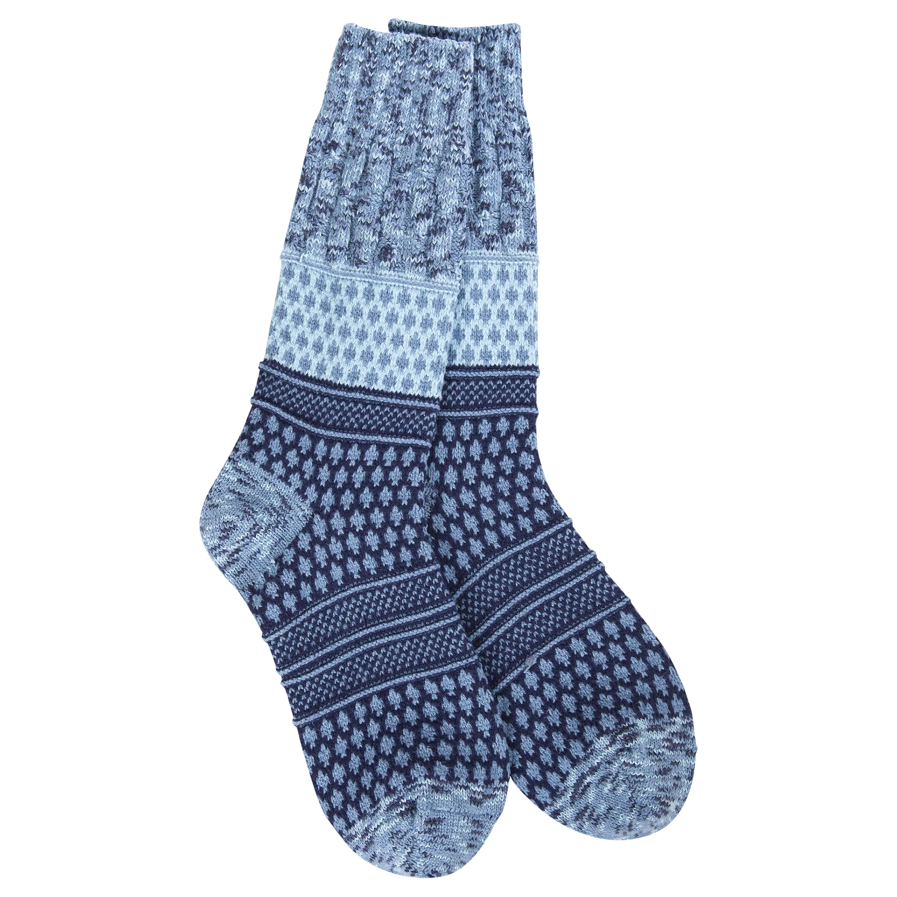 A pair of plush, soft crew socks with a patchwork design featuring various geometric patterns in shades of navy and blue.