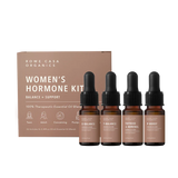 Balanced Hormone Essential Oil Kit with four 10ml roll-ons labeled E-Balance, P-Boost, T-Balance, and Thyroid + Adrenal Support, displayed upright next to the product instruction insert