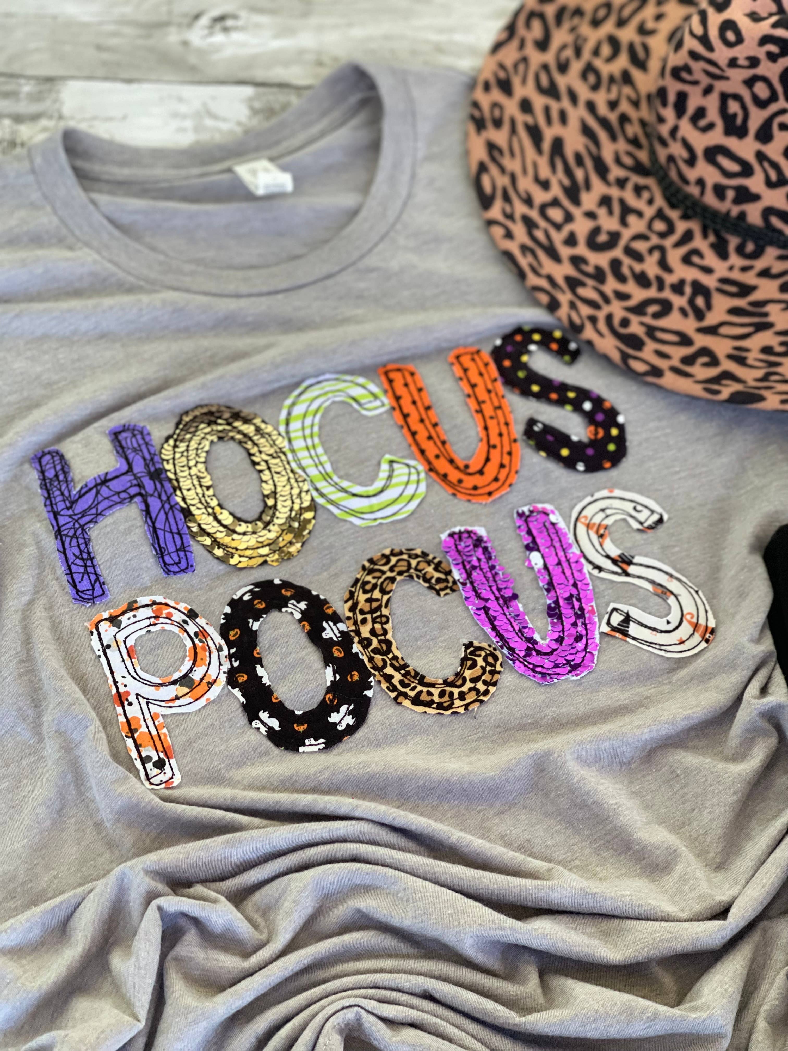 Athletic grey Bella + Canvas tee with Hocus Pocus appliqué design