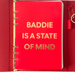 Red notebook with gold text 'BADDIE IS A STATE OF MIND'