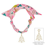 Pink silk scarf necklace with Santa print and removable gold Christmas tree charm.