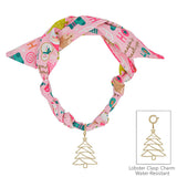 Pink silk scarf necklace with Santa print and removable gold Christmas tree charm.