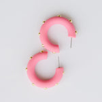 Candace bubble gum hoop earrings with gold studs.