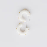 Candace white hoop earrings with gold studs.