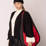 red bag with black sides quilted puffer bag