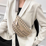 View of model wearing the beige checkered crossbody bag.