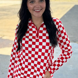 Red and white checkered pullover with collared neckline, quarter-zip front, and kangaroo pocket, laid flat to highlight pattern and details.