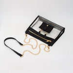 black clear crossbody bag with gold hardware and removable sunglasses holder, combining bold style with stadium-friendly function.
