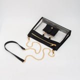 Clear crossbody bag with black trim, gold hardware, and a detachable sunglasses holder—fun, functional, and stadium-approved.